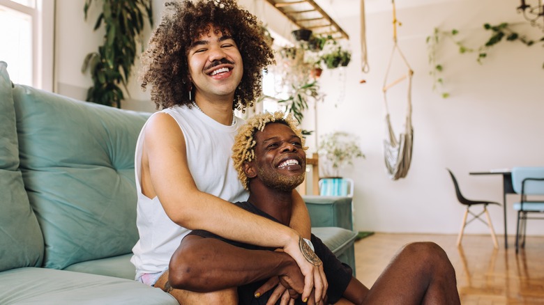 happy queer couple smiling