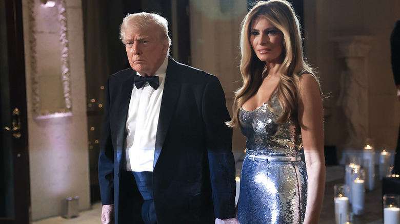 Donald Trump and Melania Trump looking unhappy.