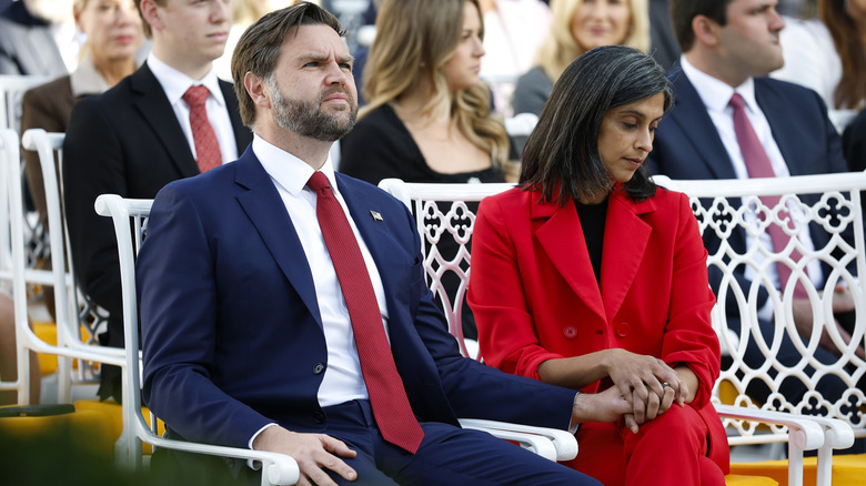 JD Vance and Usha Vance holding hands.