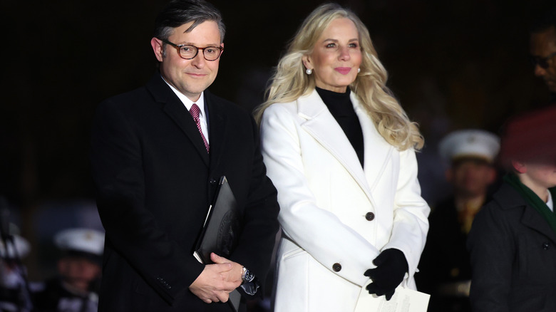 Mike Johnson standing next to his wife, Kelly Johnson