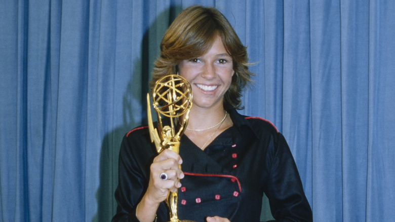 Kristy McNichol holding Emmy she won for performance in drama series 'Family,' 1979