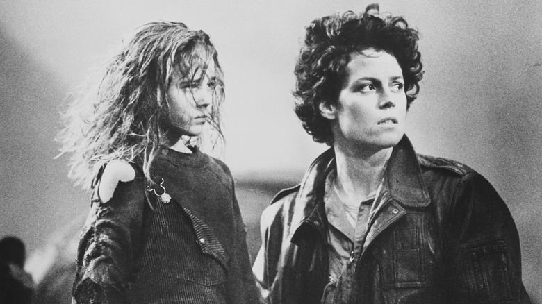 Carrie Henn and Sigourney Weaver on the movie set for Aliens 2