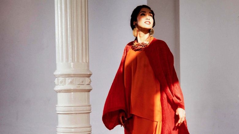 Portrait of Filipino fashion model Anna Bayle (in a dress designed by Oscar de la Renta), New York, New York, circa 1987.