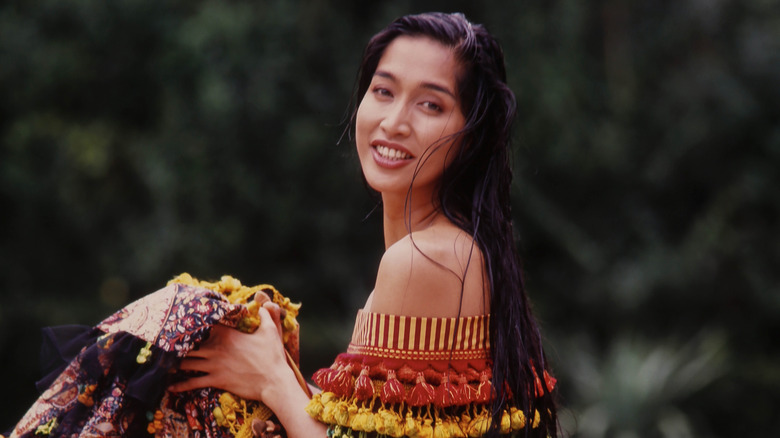 Portrait of Filipino fashion model Anna Bayle as she poses outdoors, New York, New York, circa 1985.