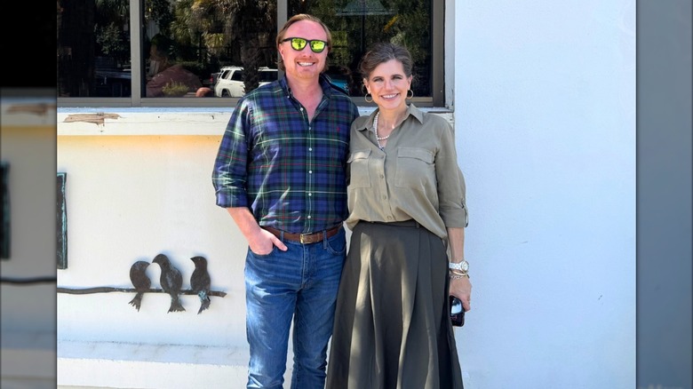 Kevin Phillips and Nancy Mace standing together in front of a window.