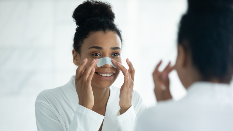 Woman applying pore strip