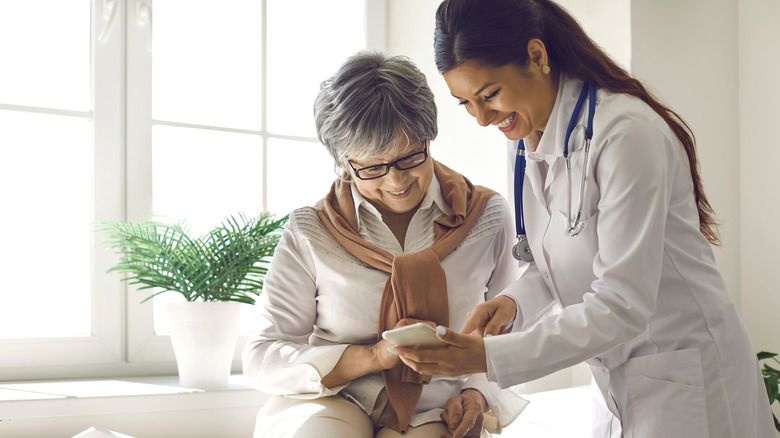 woman with gray hair at doctor's office