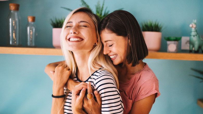 Female couple laughing
