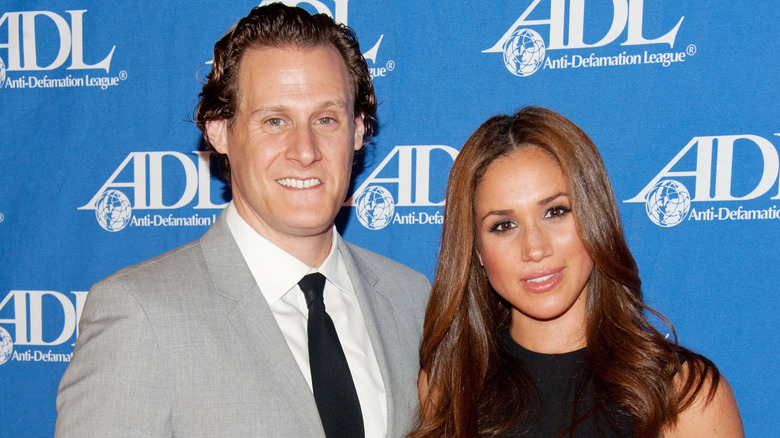 Trevor Engleson and Meghan Markle smiling