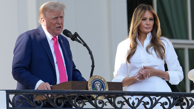 Donald Trump delivering a speech with Melania standing next to him