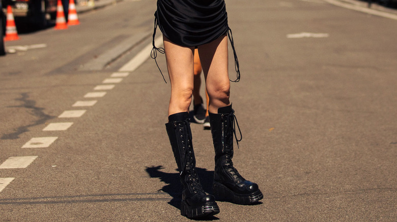woman wearing tall combat boots