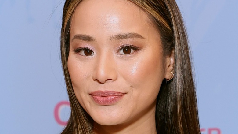 Jamie Chung smiling on the red carpet