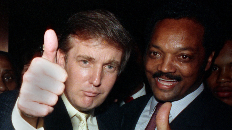 Donald Trump and Jesse Jackson each giving a thumbs up