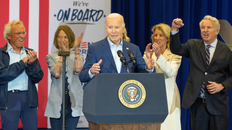 Kennedy family members clapping and cheering while endorsing Joe Biden