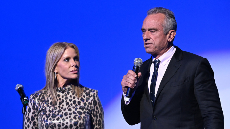 Cheryl Hines looking at RFK Jr. as he speaks at an event