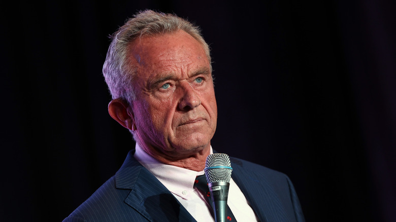 RFK Jr. holds a microphone
