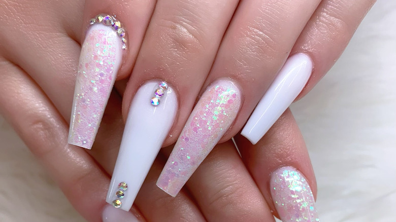 pink nails with iridescent rhinestones