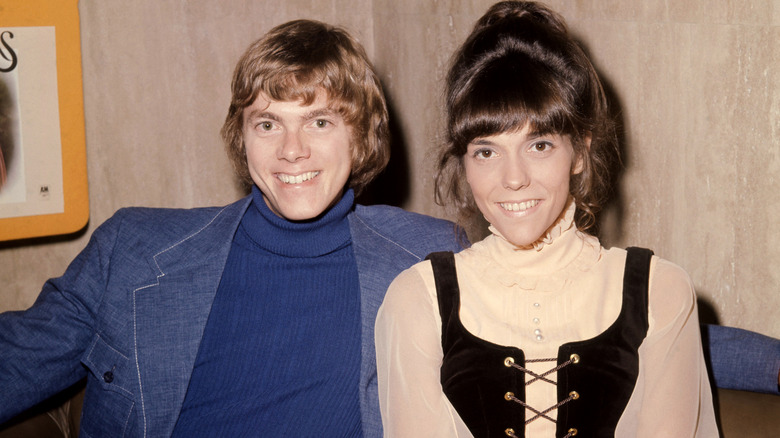 Richard and Karen Carpenter smiling and posing.