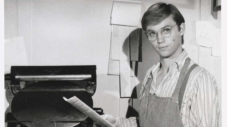 Richard Thomas holding papers
