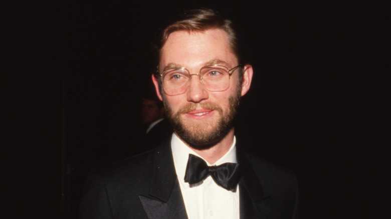 Richard Thomas smiling in a beard and tuxedo