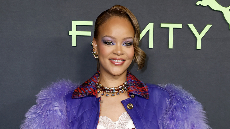 Rihanna posing at a Fenty event