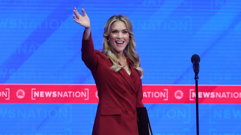 Megyn Kelly waving onstage at a NewsNation event