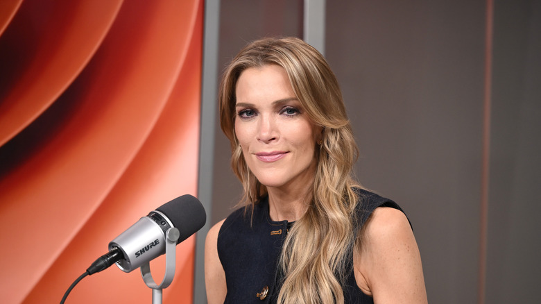 Megyn Kelly sitting in front of a microphone