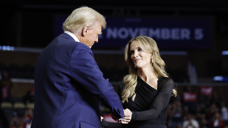 Megyn and Donald Trump shaking hands on a stage
