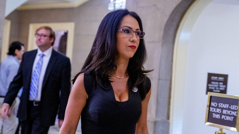 Lauren Boebert walking through government hall