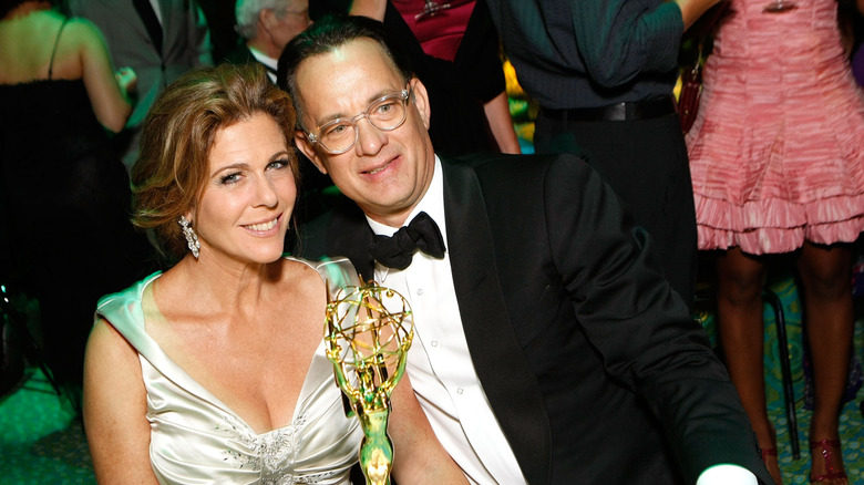 Rita Wilson and Tom Hanks posing with an Emmy statue in September 2008