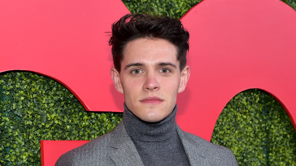 Riverdale star Casey Cott poses on the red carpet