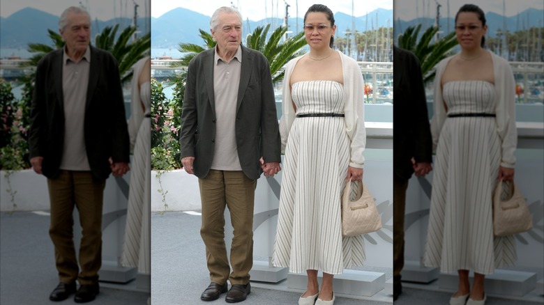 Robert De Niro and Tiffany Chen holding hands
