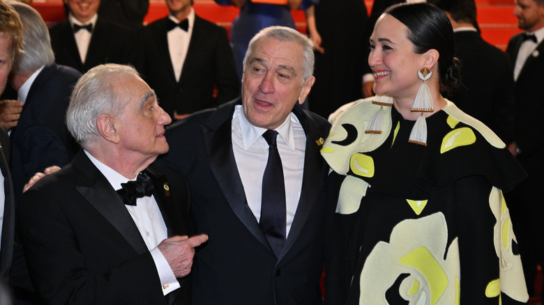 Martin Scorsese, Robert De Niro and Lily Gladstone depart the "Killers Of The Flower Moon" red carpet during the 2023 Cannes film festival.