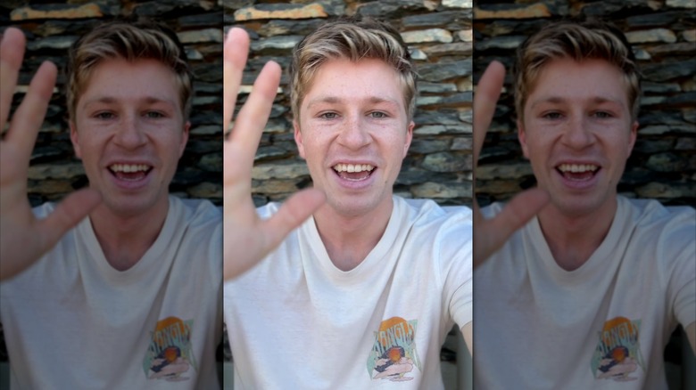A screenshot from Robert Irwin's TikTok showing himself waving at the camera