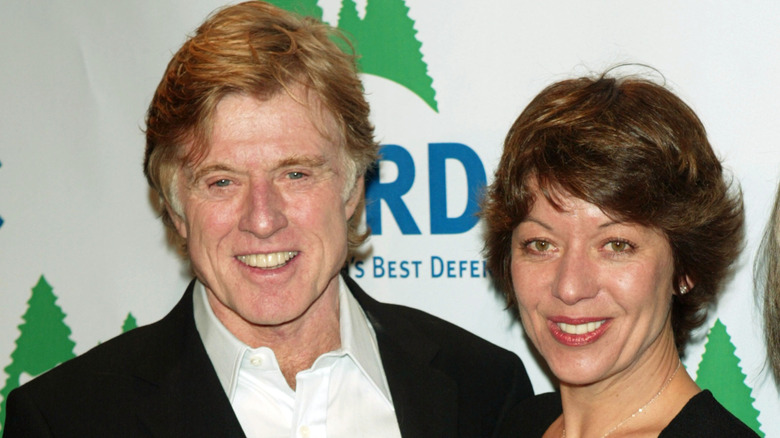 Robert Redford and Sibylle Szaggars smiling together
