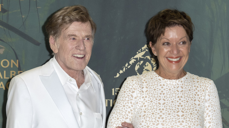 Robert Redford and Sibylle Szaggars smiling together