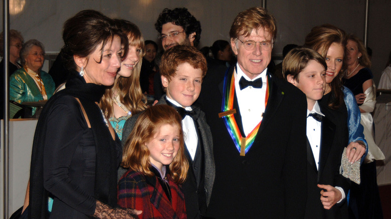 Sibylle Szaggars and Robert Redford smiling with Redford's grandkids