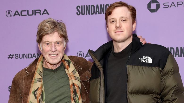 Dylan Redford posing with Robert Redford