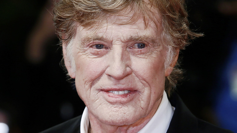 Robert Redford smiling in suit