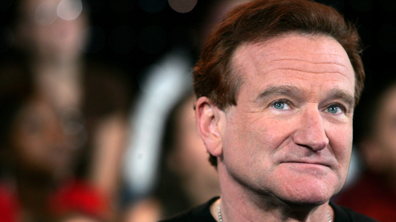 Robin Williams looking up and to the side