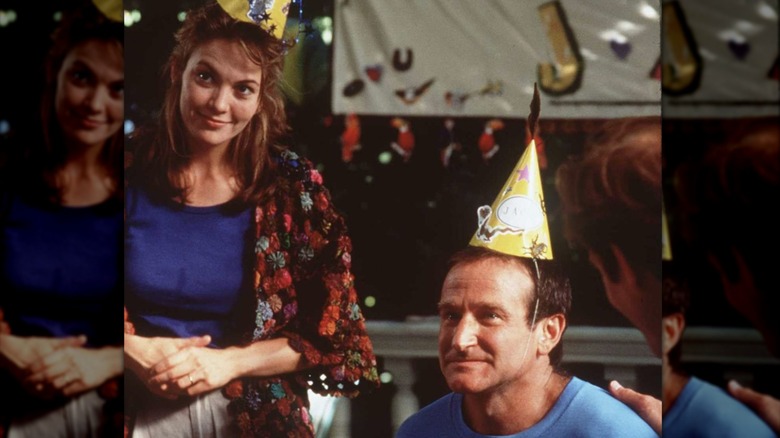 Diane Lane and Robin Williams wearing party hats in "Jack"