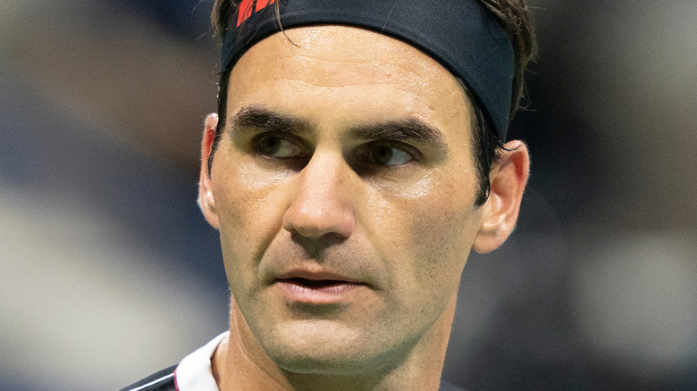 Roger Federer mid-tennis match