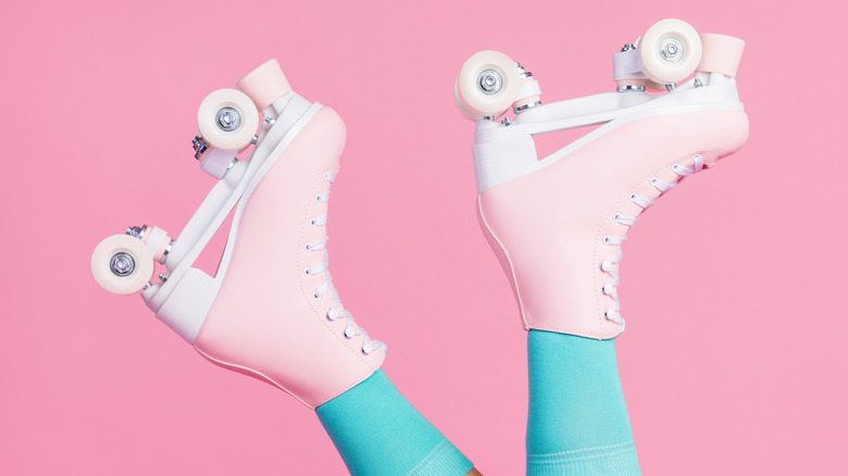 A pair of pink roller skates