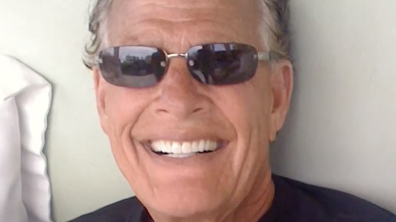 Ron Popeil smiling, shades