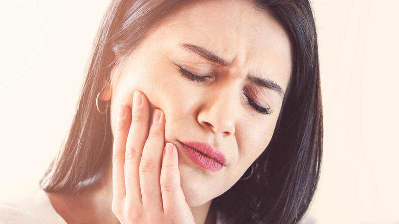 Woman with tooth pain 