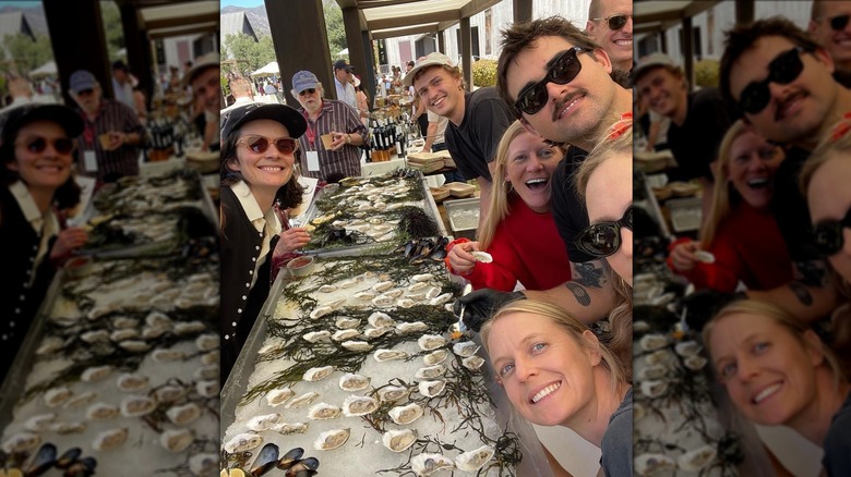 Rose Kennedy Schlossberg, Rory McAuliffe, and friends smile around a table of oysters