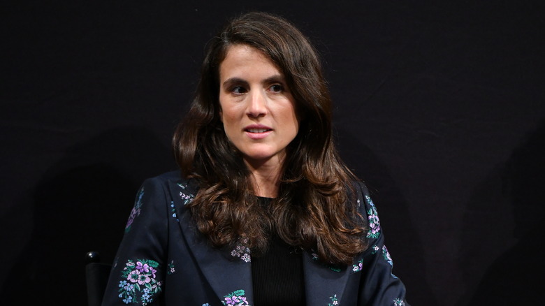 Closeup of Tatiana Schlossberg on stage against black background