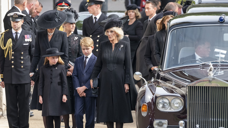 Kate Middleton, Camilla Parker Bowles, George and Charlotte posing 