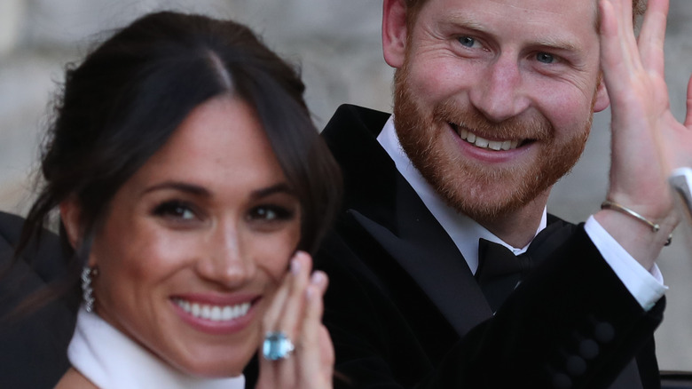 Prince Harry and Meghan Markle waving