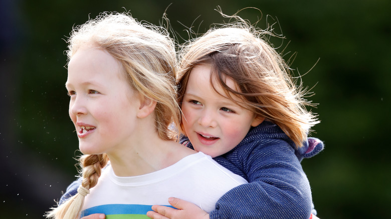 Mia Tindall piggybacking Savannah Phillips